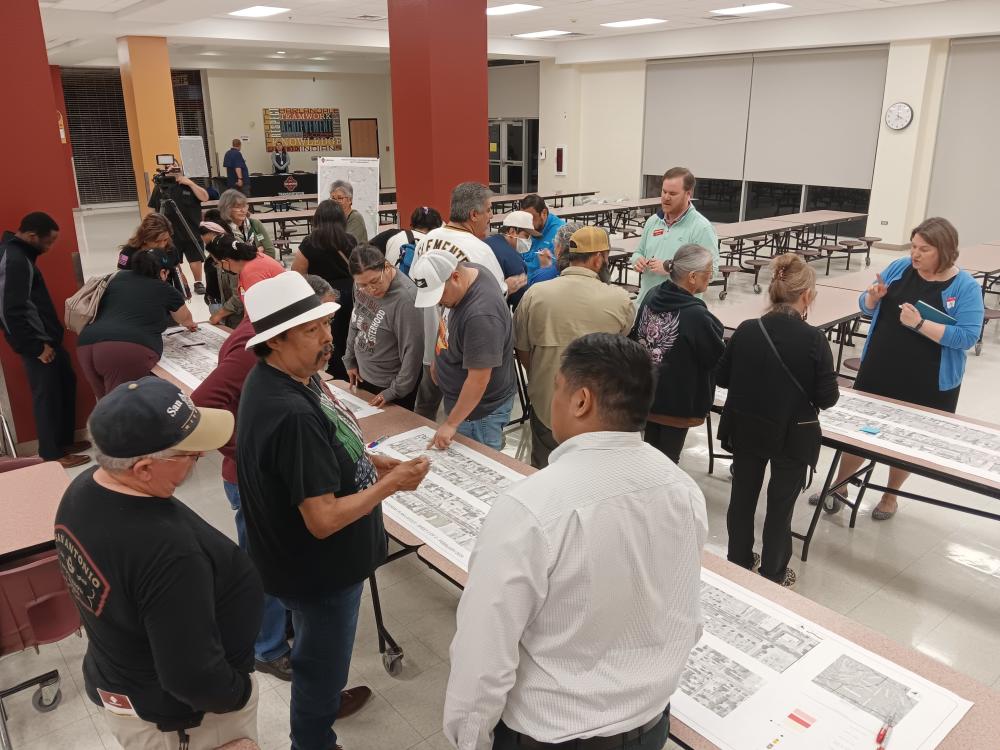 group of harlandale neighborhood residents talk with transportation designers about the pleasanton road project.