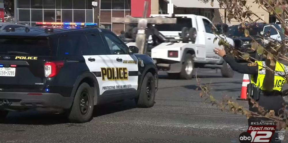 officers gather at the site of a deadly hit and run on pleasanton road. image courtey of ksat 12 news